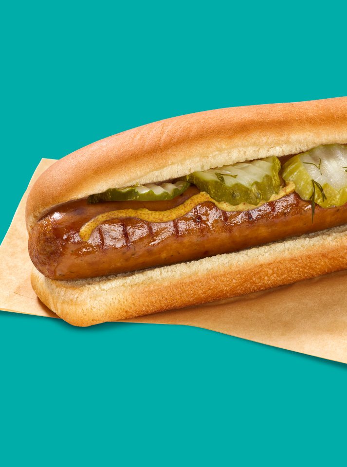 photo-designed-to-drive-6ab156008115d Spicy Dill Pickle Flavored Ultimate Sausage™ topped with pickles and mustard